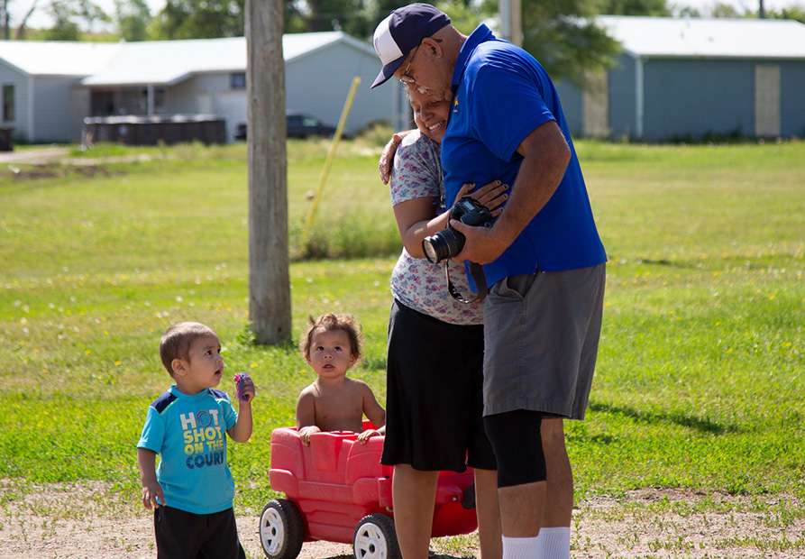 Alumni Team Member Hugging Former Student