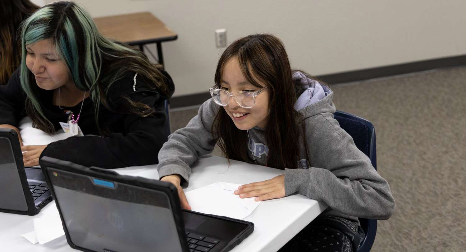 computer-students-parent-portal Middle School students looking at a computer