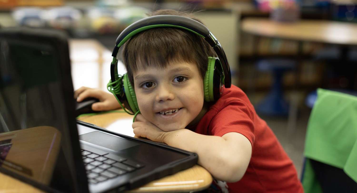 young student with a computer