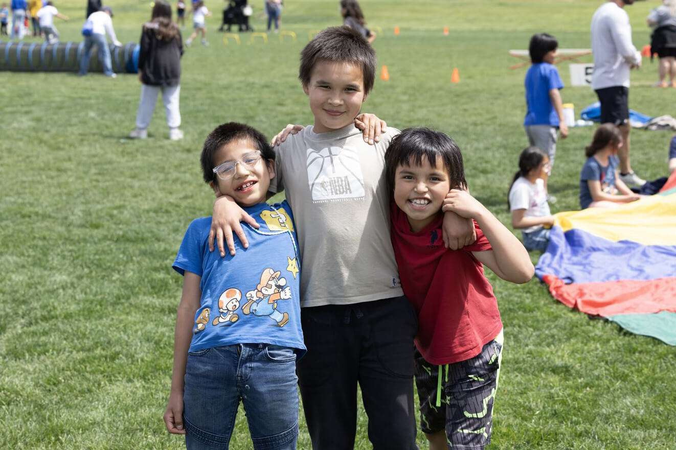 Three younger St.Joe students outside